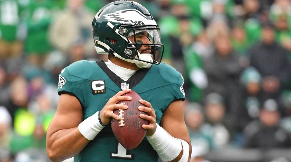 Philadelphia Eagles quarterback Jalen Hurts drops back to pass in a game.