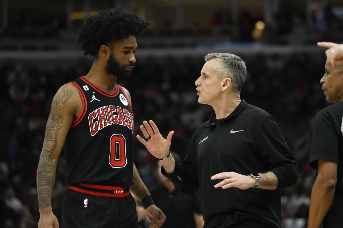 Chicago Bulls guard Coby White (0) talks with head coach Billy Donovan during the first half at the United Center. 