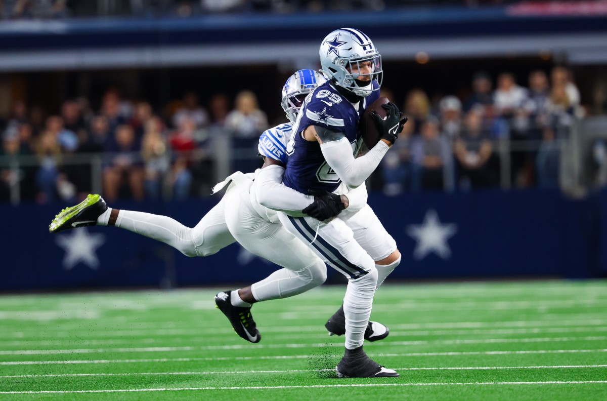Dallas Cowboys tight end Peyton Hendershot (89) catches a pass as Detroit Lions safety Kerby Joseph (31) defends during the first half at AT&T Stadium.