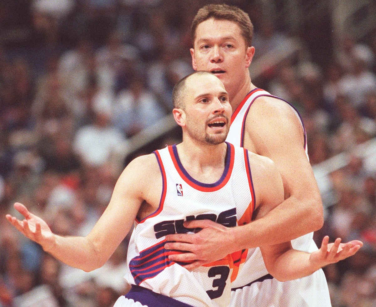 Suns Rex Chapman (front) is restrained by teammate Luc Longley after questioning a foul in the first half during game 3 action at AWA, 5/12/99. The Suns lost the series to the Portland Trail Blazers 0-3.