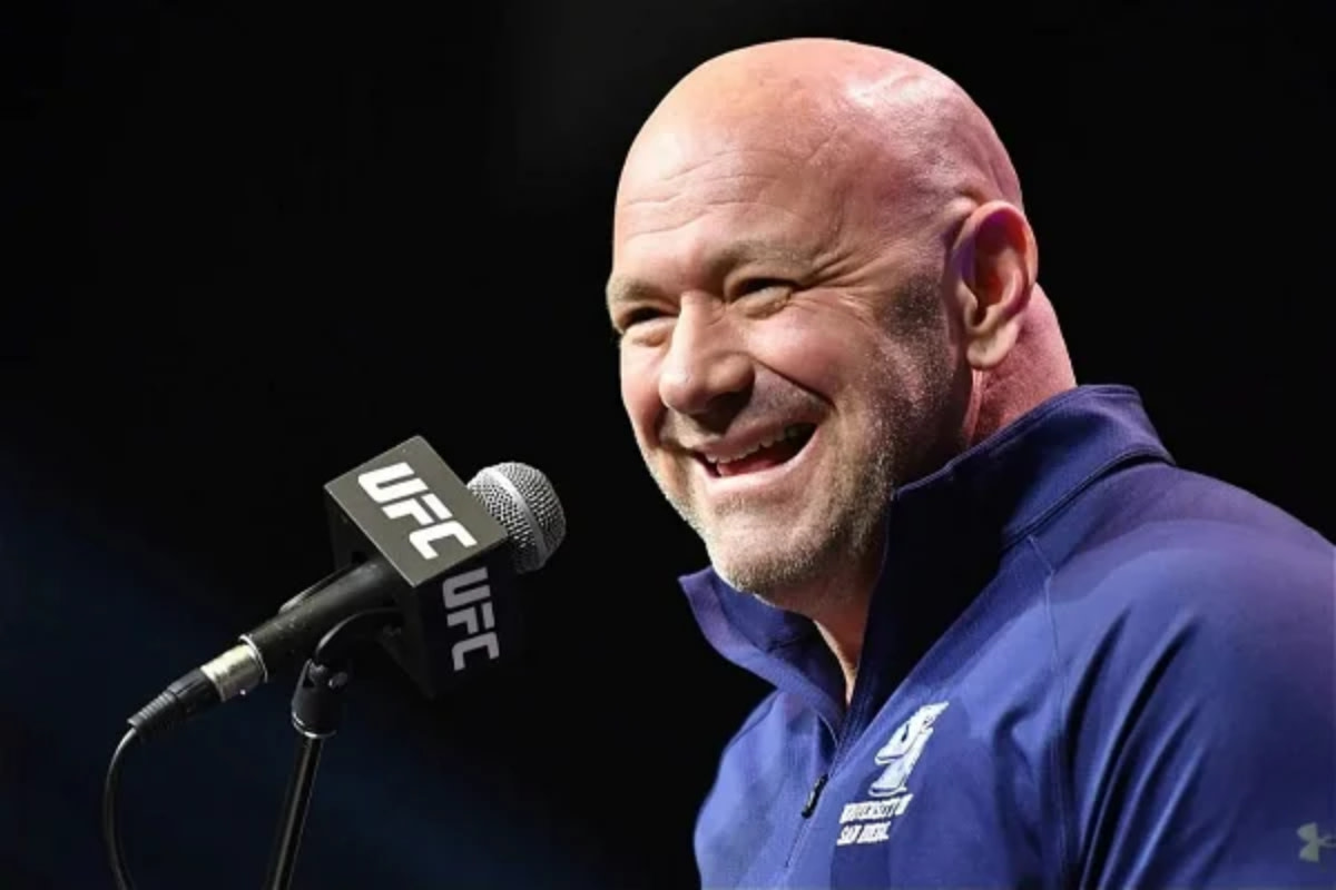 UFC CEO Dana White has a laugh with reporters during a press conference.