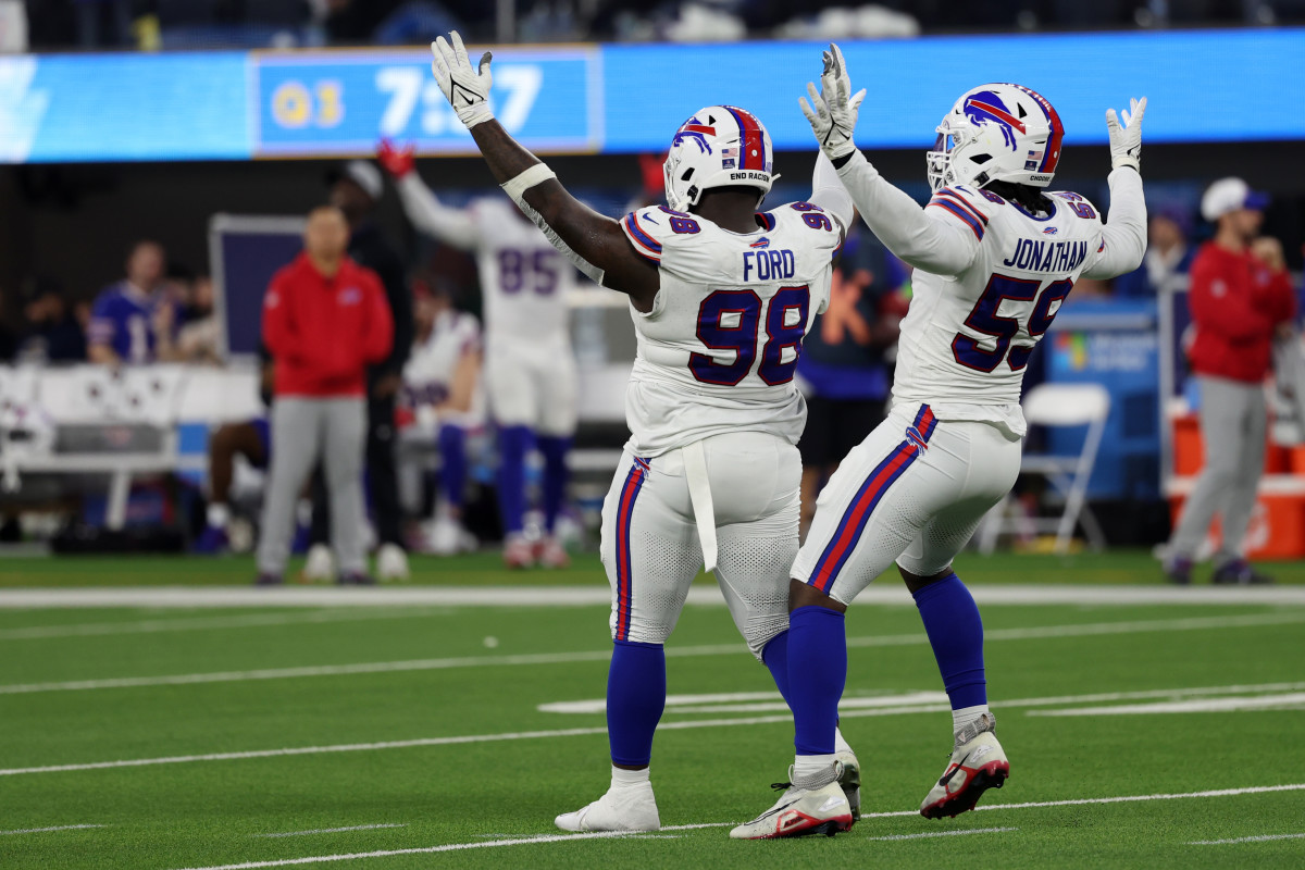 Dec 23, 2023; Inglewood, California, USA; Buffalo Bills defensive tackle Poona Ford (98) celebrates with defensive end Kingsley Jonathan (59) after making a quarterback sack during the third quarter against the Los Angeles Chargers at SoFi Stadium. Mandatory Credit: Kiyoshi Mio-USA TODAY Sports 
