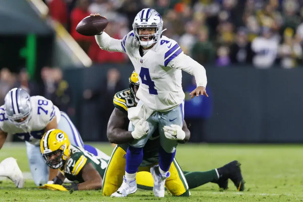 Dallas Cowboys quarterback Dak Prescott (4) throws a pass during overtime against the Green Bay Packers at Lambeau Field.