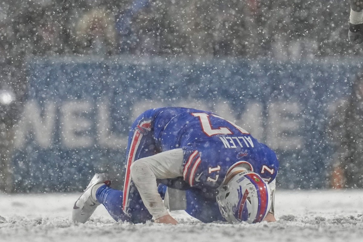 Buffalo Bills quarterback Josh Allen (17) remains down after a hard hit from Cincinnati Bengals cornerback Mike Hilton (21) in the fourth quarter of the NFL divisional playoff football game between the Cincinnati Bengals and the Buffalo Bills, Sunday, Jan. 22, 2023, at Highmark Stadium in Orchard Park, N.Y. 
