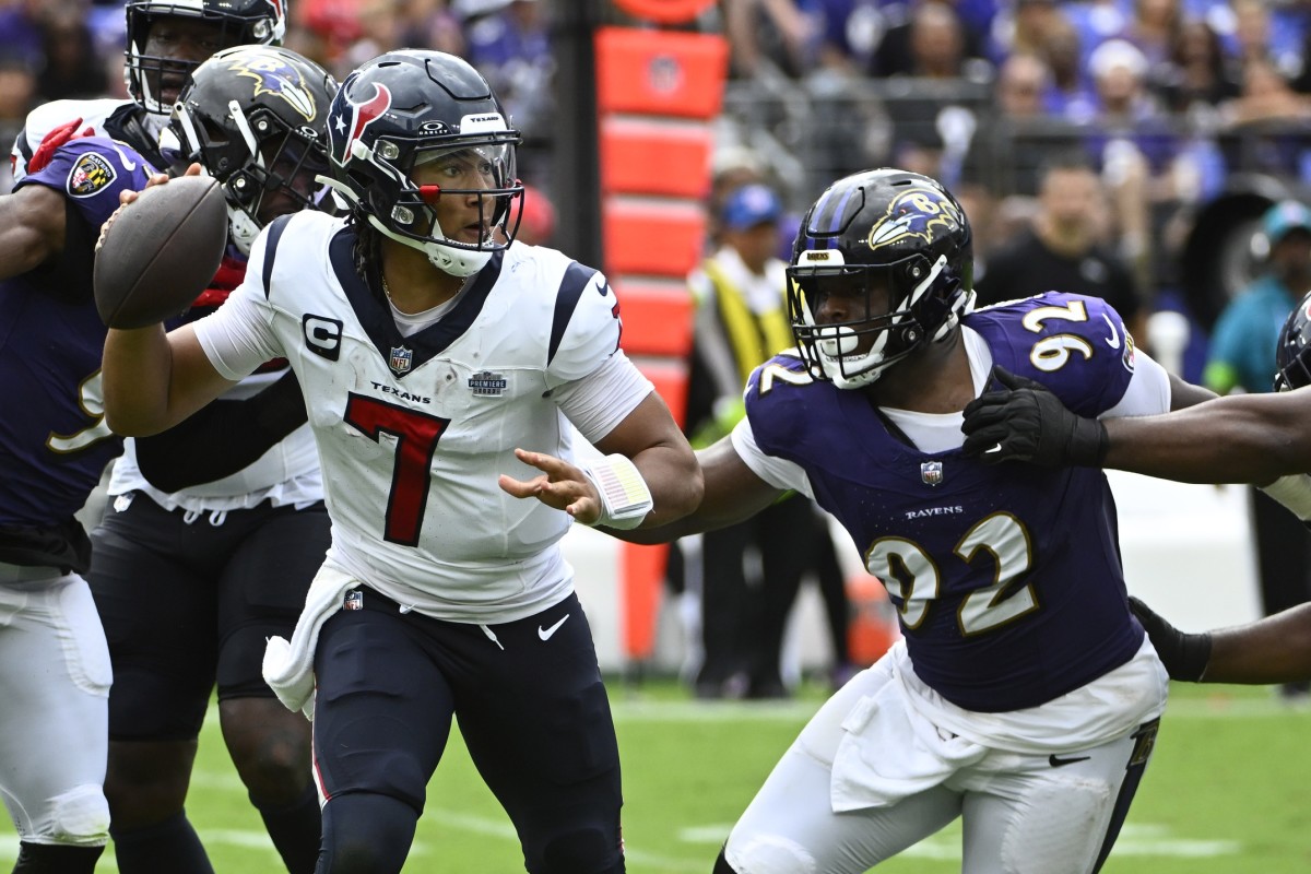 Sep 10, 2023; Baltimore, Maryland, USA; Houston Texans quarterback C.J. Stroud (7) attempts a pass as Baltimore Ravens defensive tackle Rayshad Nichols (91) rushes during the second half at M&T Bank Stadium. 