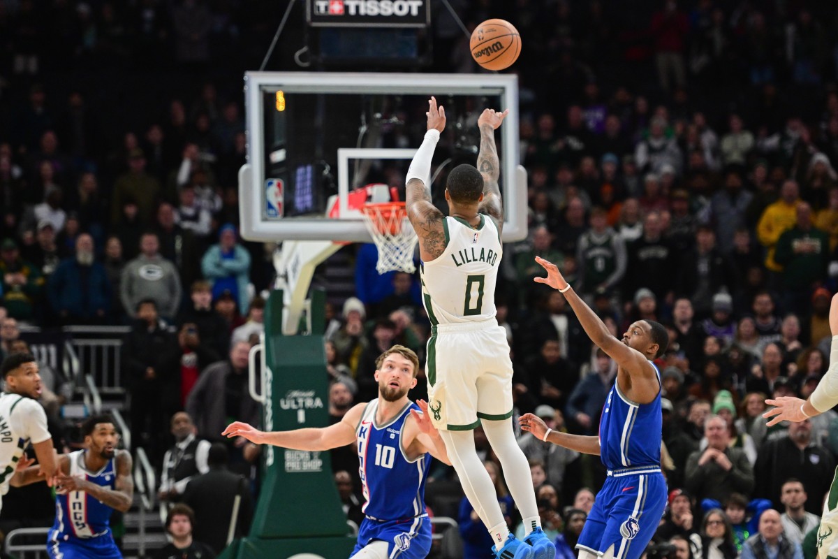 Milwaukee Bucks guard Damian Lillard (0) scores the game-winning three-point basket at the end of overtime against the Sacramento Kings