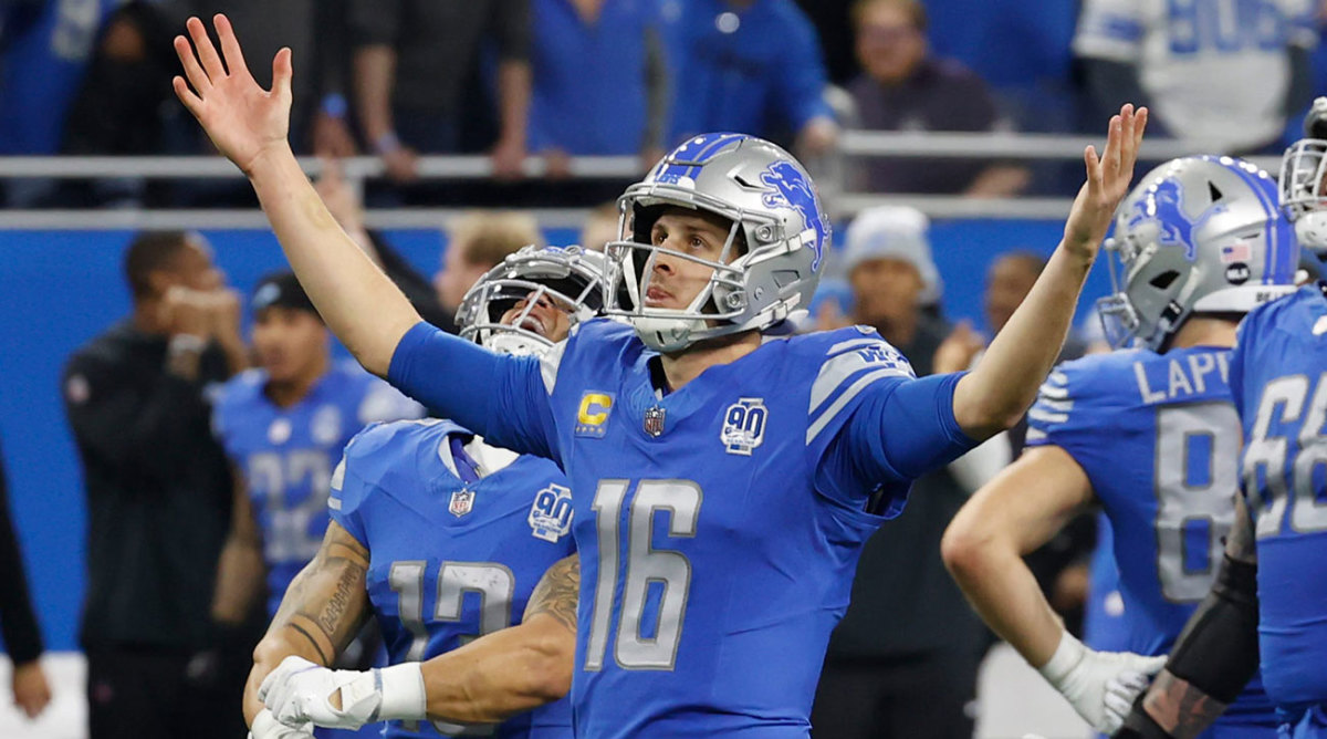 Jared Goff lifts both hands up to the sky as the Lions beat the Rams in a wild-card playoff game.