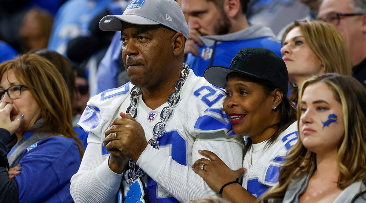 Nervous Lions fans watch their team in a wild-card game against the Rams