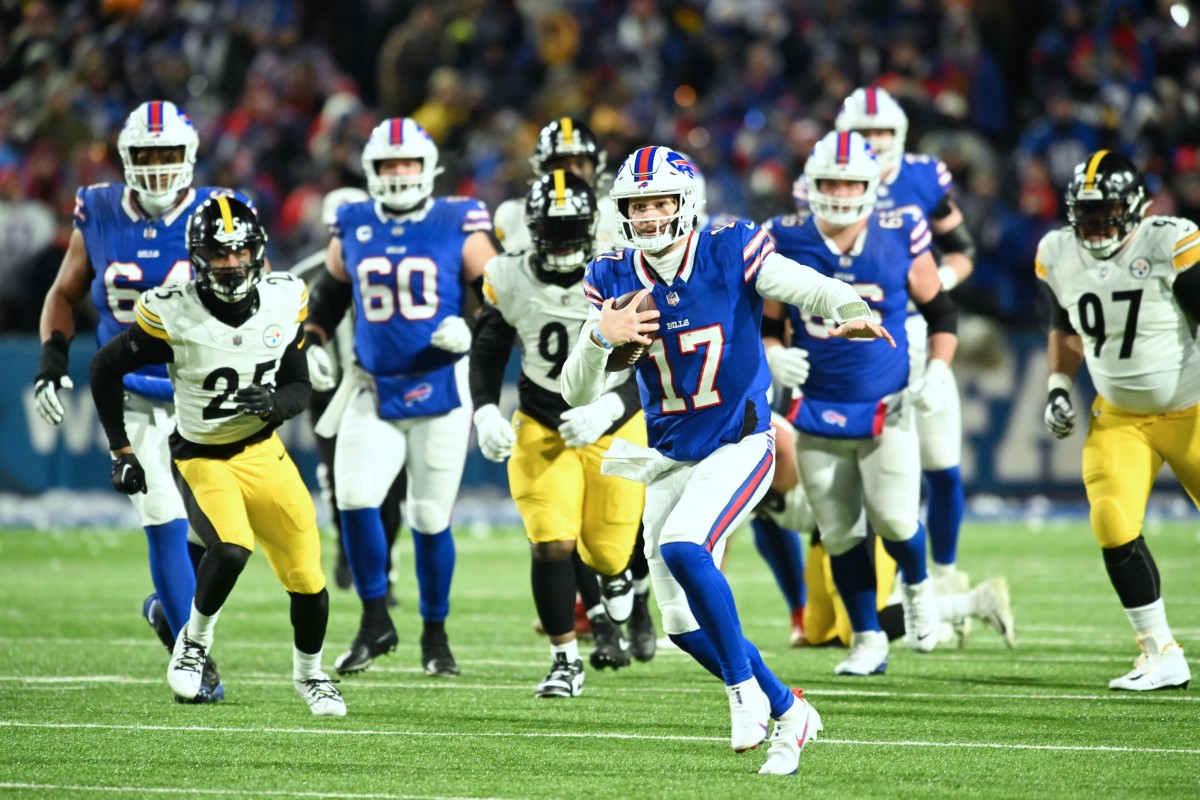 Buffalo Bills quarterback Josh Allen runs through the Pittsburgh Steelers' defense for a 52-yard touchdown in an AFC wild-card game Saturday.