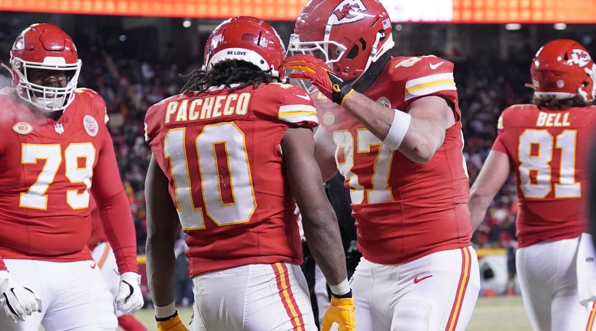 Kansas City Chiefs running back Isiah Pacheco (10) celebrates his touchdown scored against the Miami Dolphins with tight end Travis Kelce (87) during the second half of the 2024 AFC wild card game at GEHA Field at Arrowhead Stadium.
