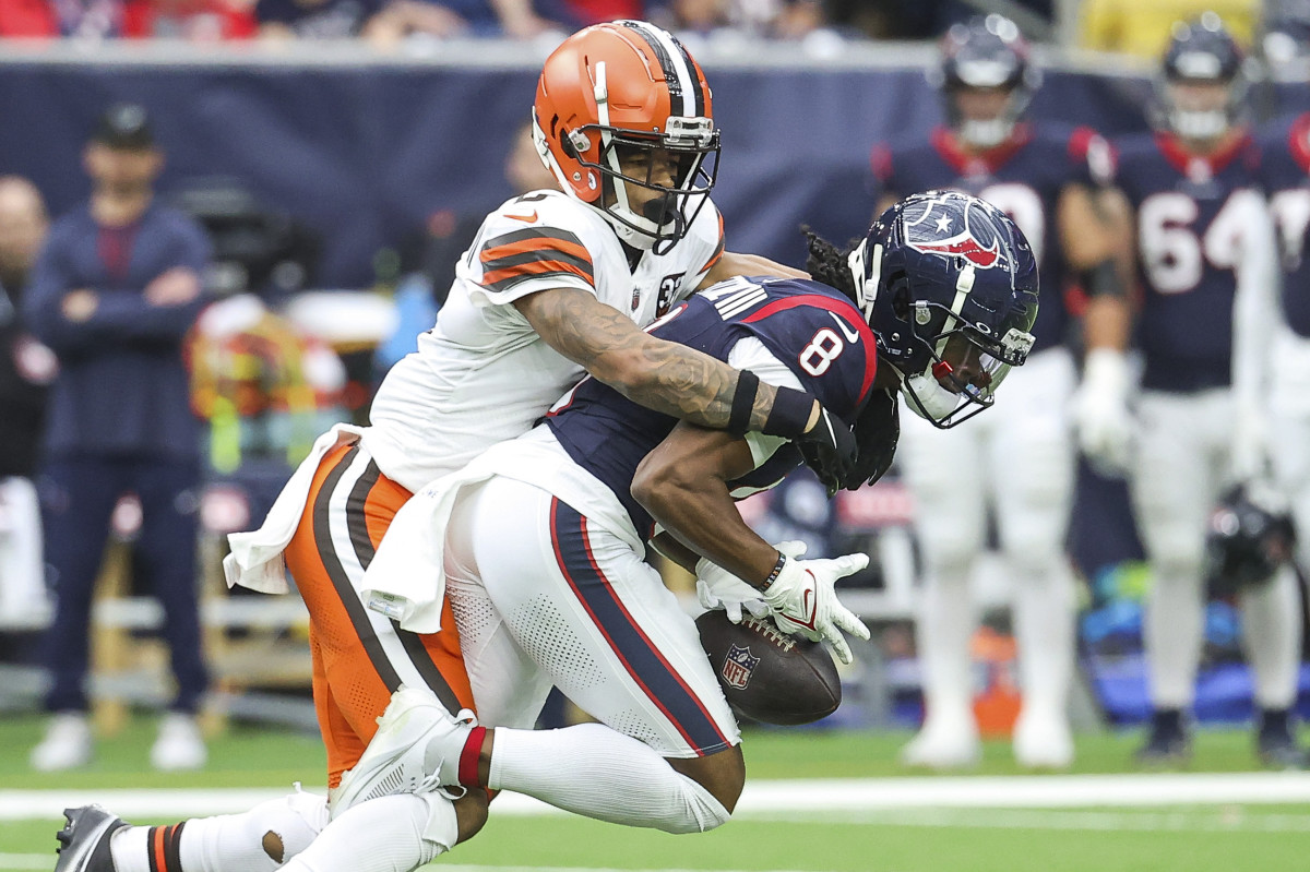 Cleveland Browns cornerback Greg Newsome II (0) defends as Houston Texans wide receiver John Metchie III (8) attempts to make a reception during the third quarter at NRG Stadium.