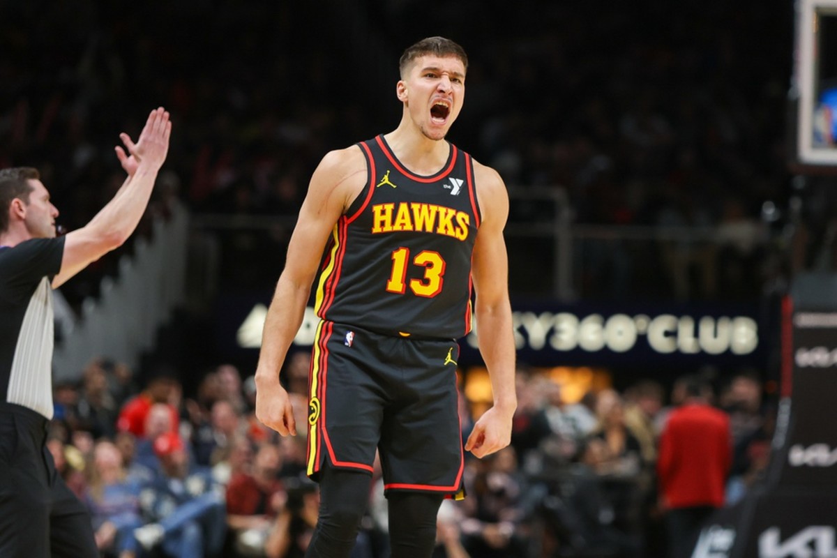 Dec 11, 2023; Atlanta, Georgia, USA; Atlanta Hawks guard Bogdan Bogdanovic (13) reacts after a basket against the Denver Nuggets in the second half at State Farm Arena.