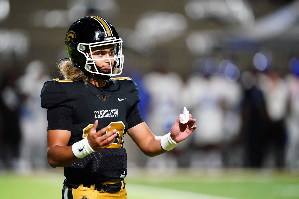 Oct 20, 2023; Carrollton, GA, USA; Carrollton Trojans quarterback Julian Lewis (10) reacts to a play against the Westlake Lions during the first half at Grisham Stadium. The 15-year-old Carrollton High student has already committed to playing for the University of Southern California Trojans and has been considered one of the top high school quarterback prospects. Mandatory Credit: John David Mercer-USA TODAY Sports