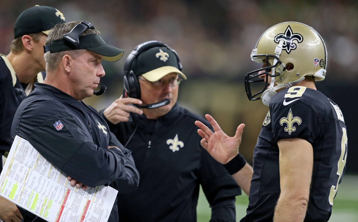 Oct 30, 2016; New Orleans Saints quarterback Drew Brees (9), right, talks to head coach Sean Payton, left, and offensive coordinator Pete Carmichael against the Seattle Seahawks. Mandatory Credit: Chuck Cook-USA TODAY