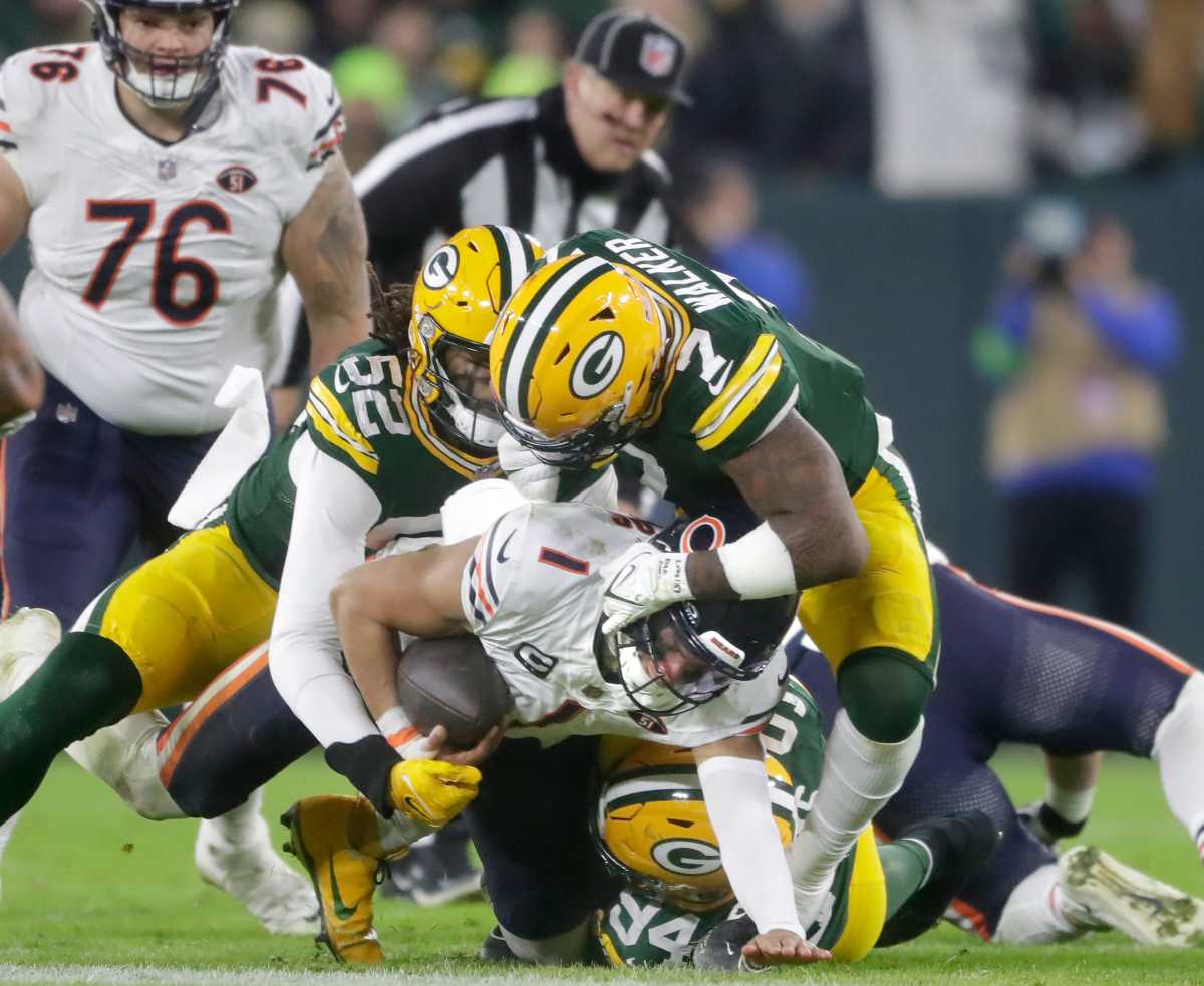 Green Bay Packers linebacker Rashan Gary (52) and linebacker Quay Walker (7) sack Chicago Bears quarterback Justin Fields (1) during their football game Sunday, January 7, 2024, at Lambeau Field in Green Bay, Wis. The Packers defeated the Bears 17-9. (Wm. Glasheen / USA TODAY NETWORK-Wisconsin).