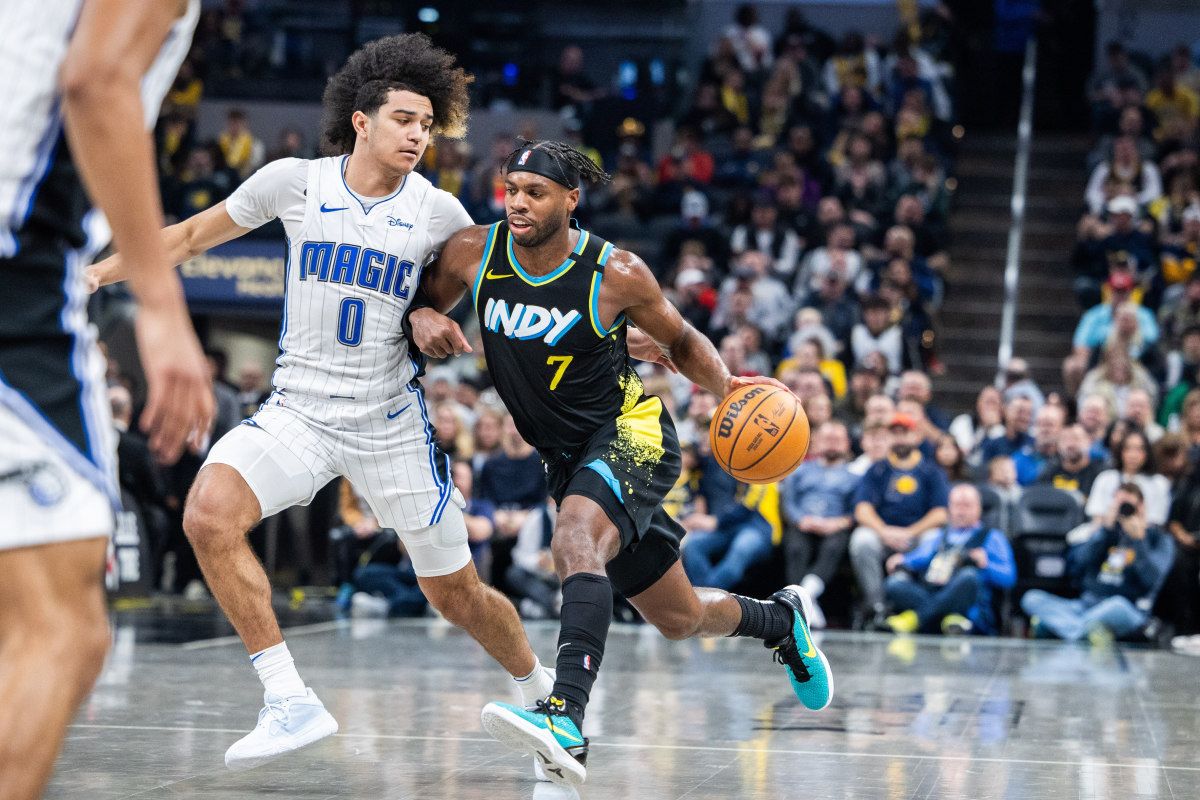 Anthony Black (0) of the Orlando Magic guards Indiana Pacers' guard Buddy Hield (7).
