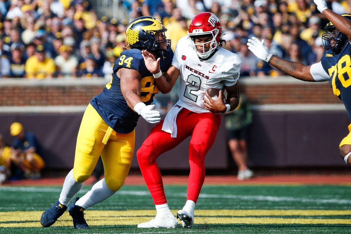 Michigan defensive lineman Kris Jenkins (94) sacks UNLV quarterback Doug Brumfield (2) during the first half at Michigan Stadium in Ann Arbor on Saturday, Sept. 9, 2023.