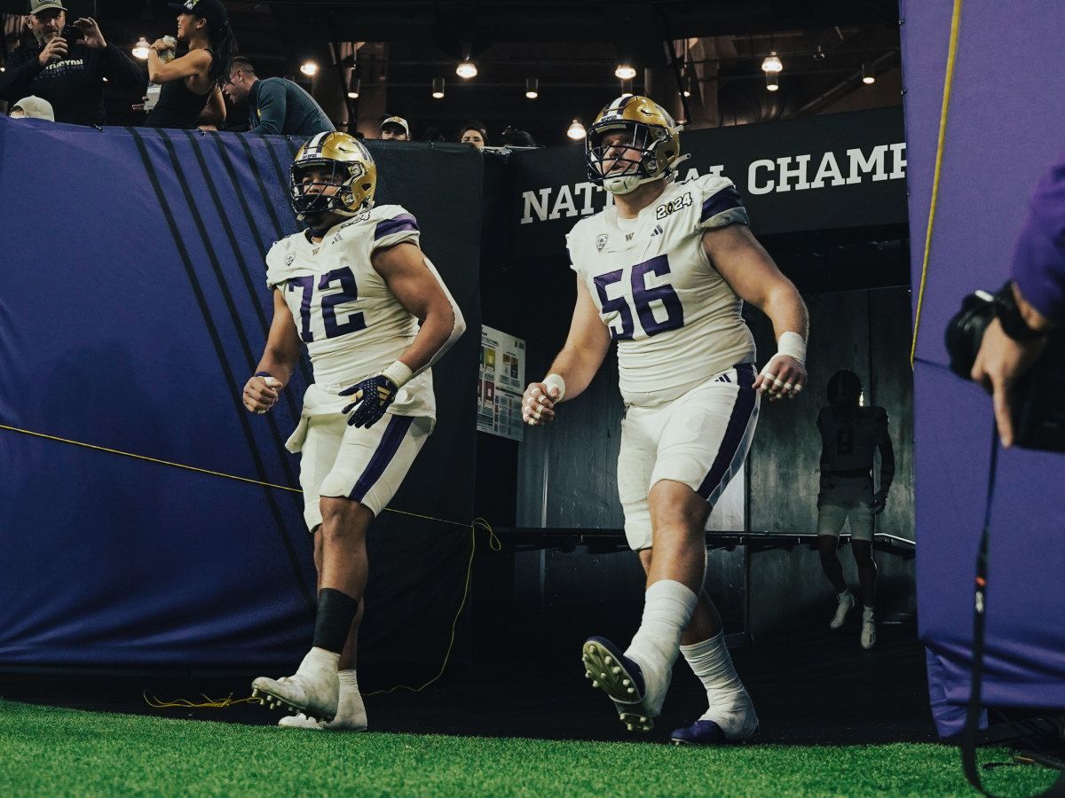 Parker Brailsford and Geirean Hatchett enter the field at the CFP title game.
