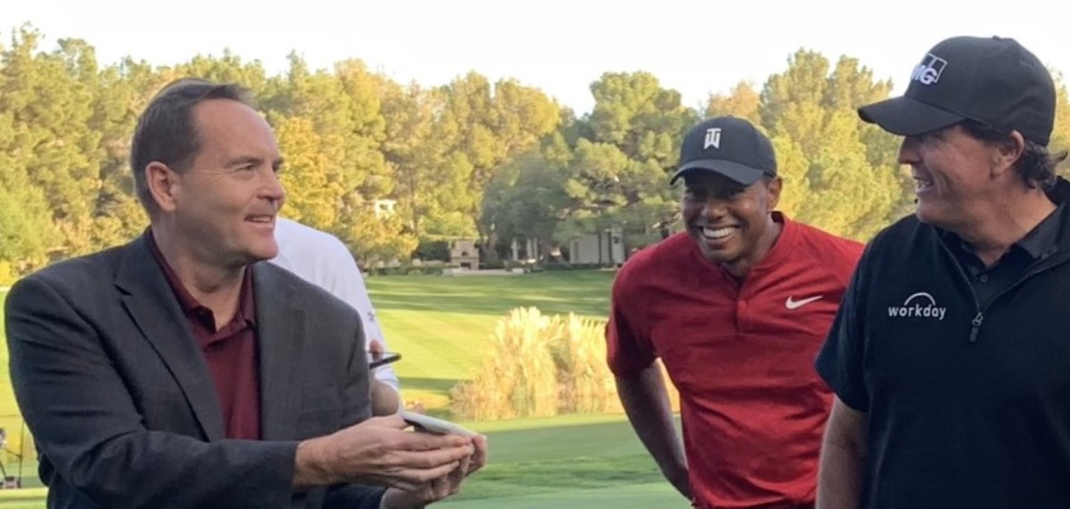 Brian Hurlburt (left) interviews Tiger Woods and Phil Mickelson