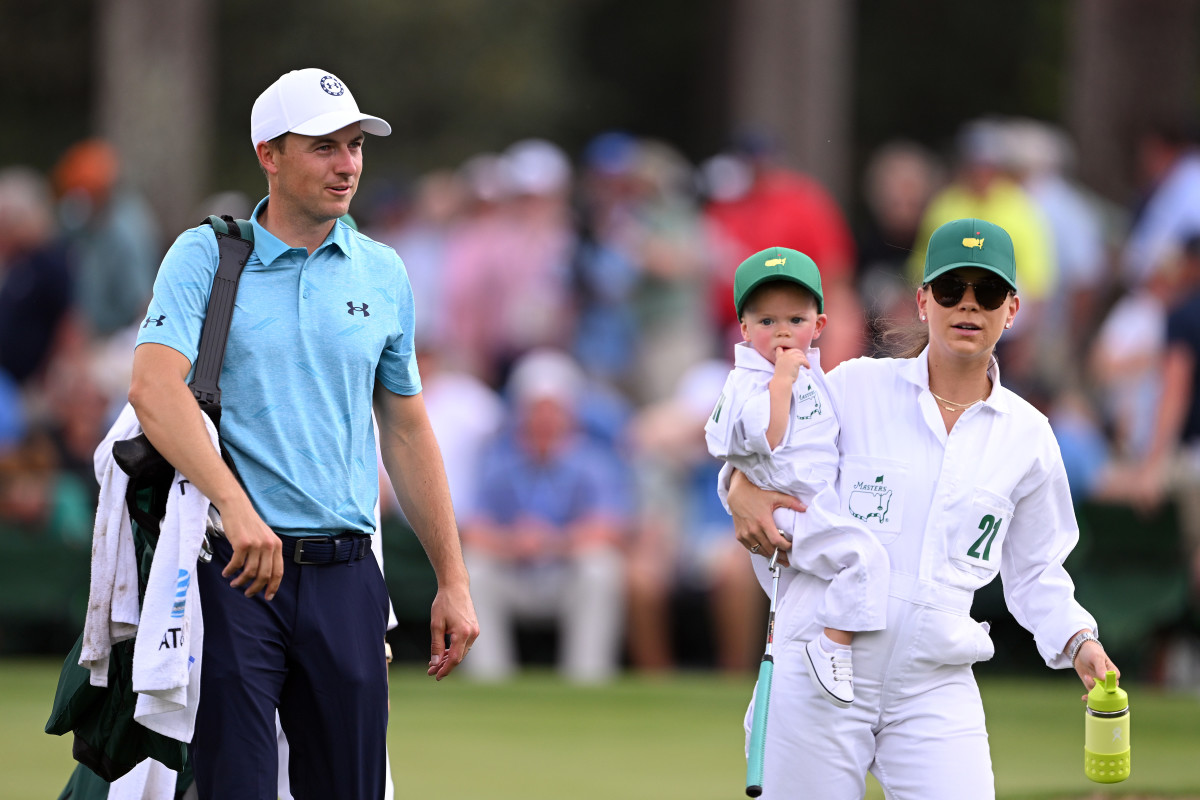 Spieth walks the Par 3 Course with his wife, Annie and son, Sammy.