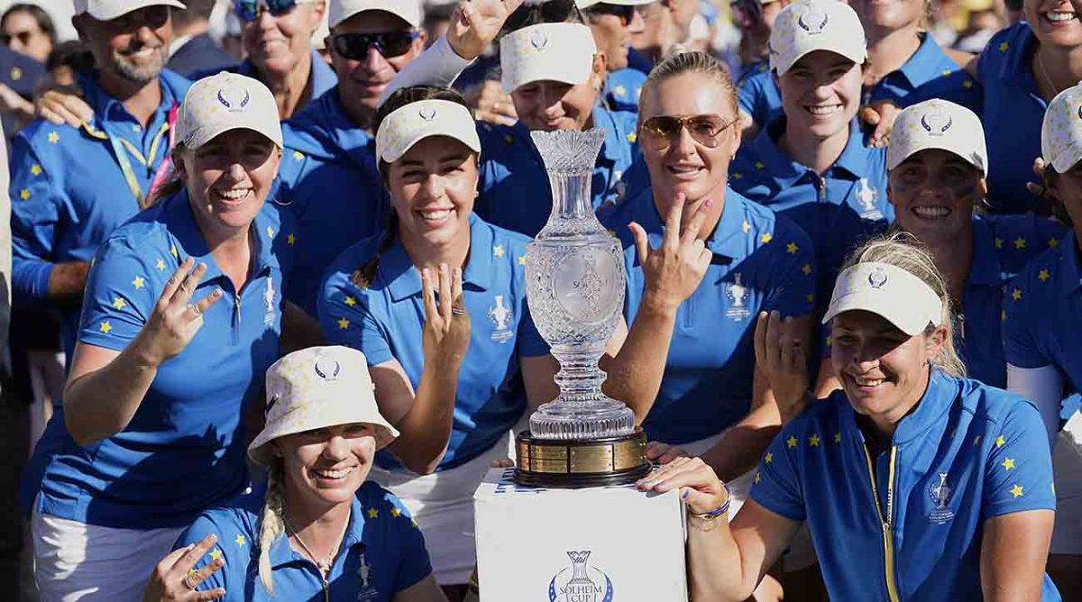Europe's Solheim Cup team members pose with the trophy after winning in Finca Cortesin, near Casares, southern Spain, Sunday, Sept. 24, 2023.