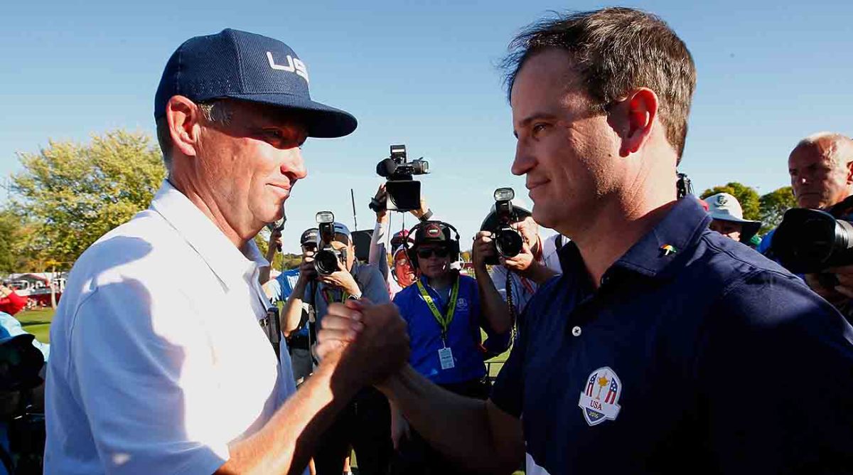 Captain Davis Love III celebrates with Zach Johnson after winning the 2016 Ryder Cup at Hazeltine National Golf Club on October 2, 2016 in Chaska, Minn.