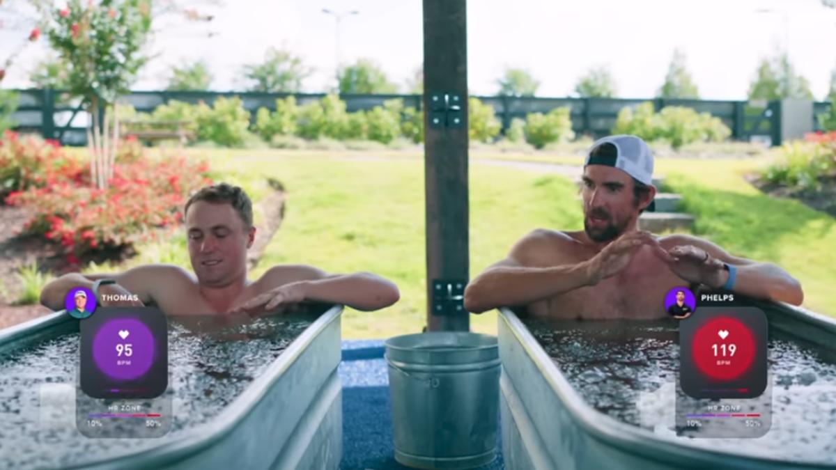 Justin Thomas and Michael Phelps take side-by-side ice baths for a PGA Tour Originals YouTube video.