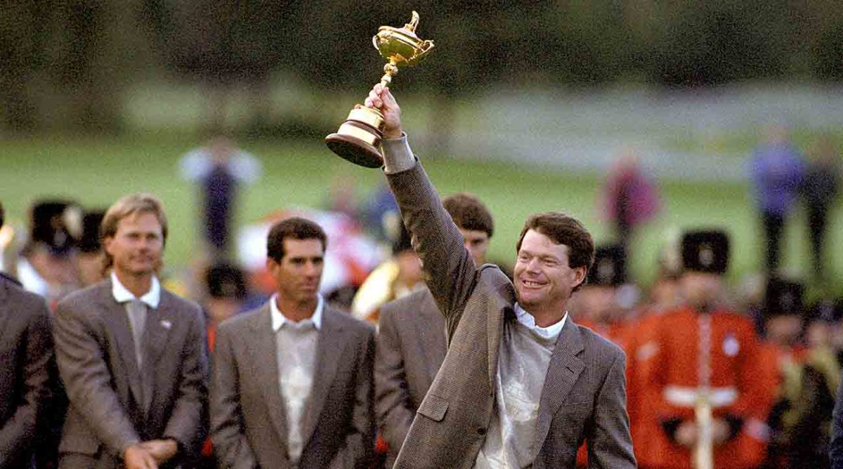 American Ryder Cup captain Tom Watson holds the cup aloft at the Belfry in 1993 after defeating the European team to retain the trophy.