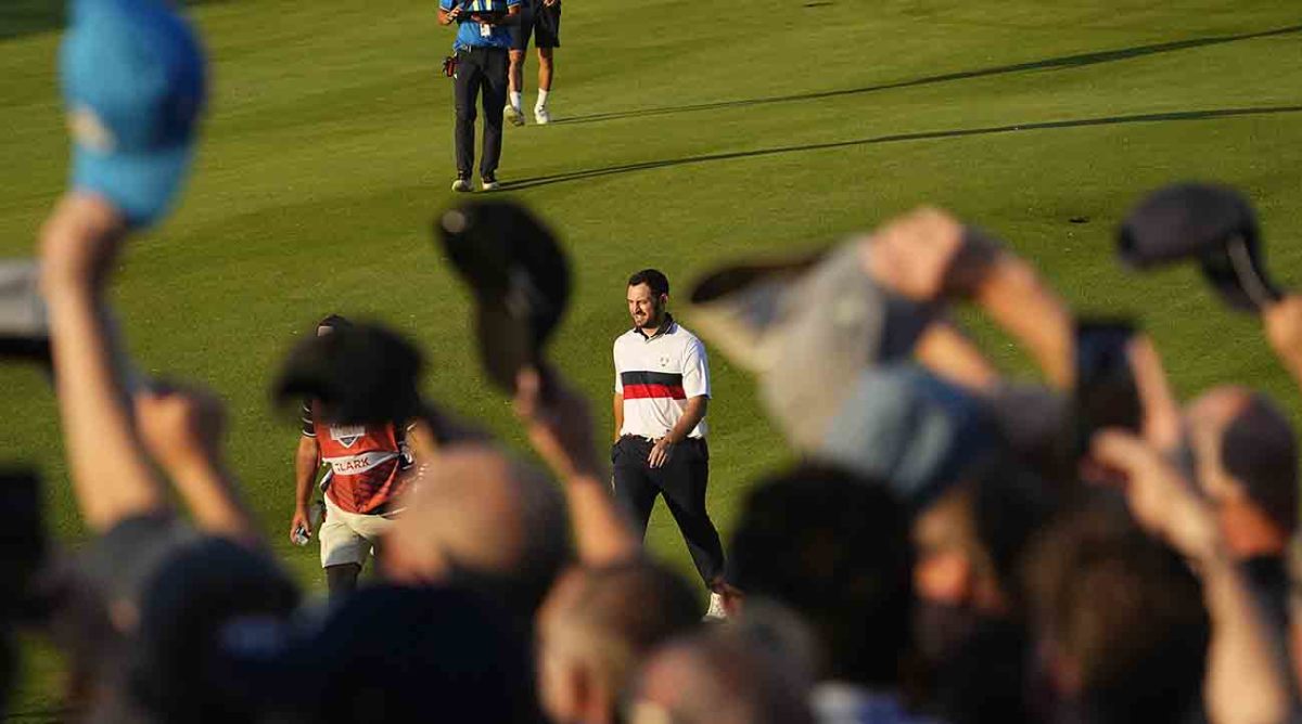 Spectators wave their caps towards Team USA golfer Patrick Cantlay on the 16th hole during Day 2 fourballs at the 2023 Ryder Cup.
