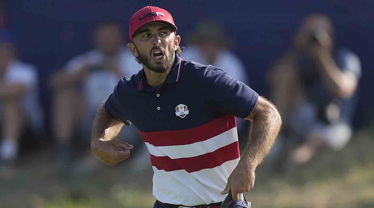 Max Homa celebrates as he wins his singles match 1 up on the 18th green at the 2023 Ryder Cup.