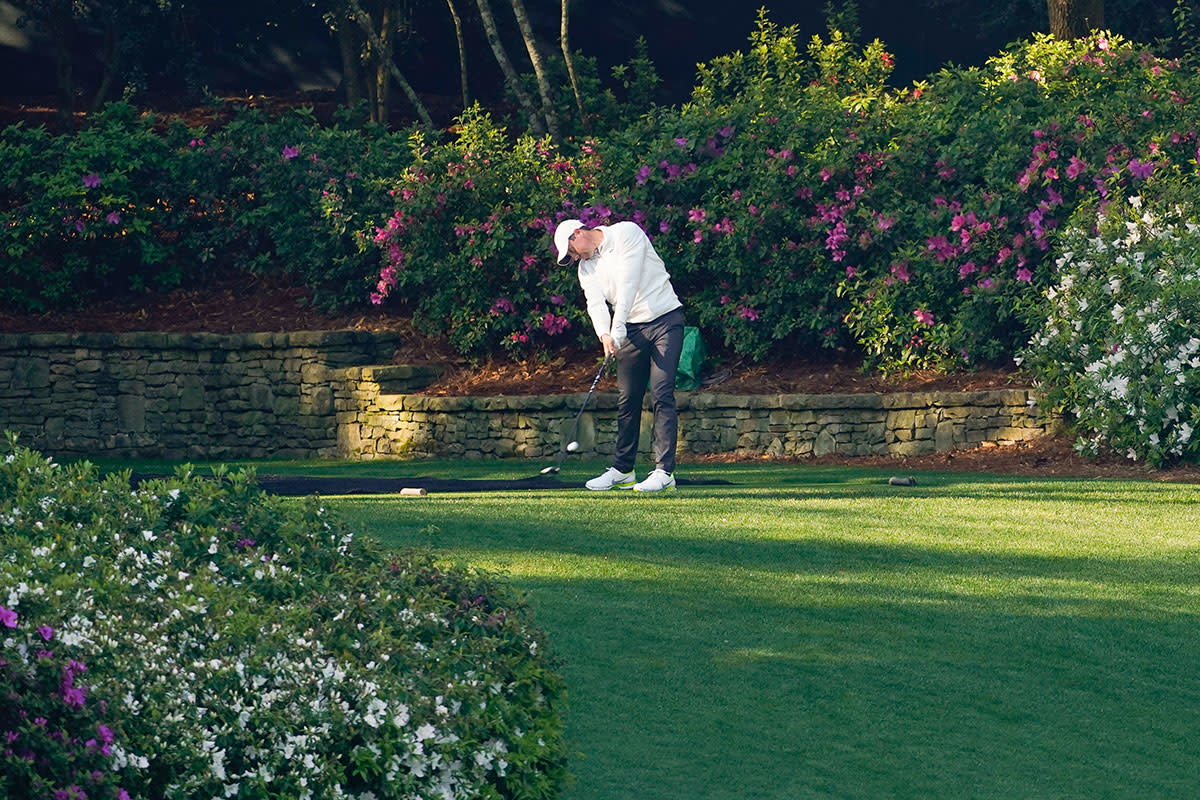 Rory McIlroy hits his tee shot on No. 13 during a practice round for the 2021 Masters.