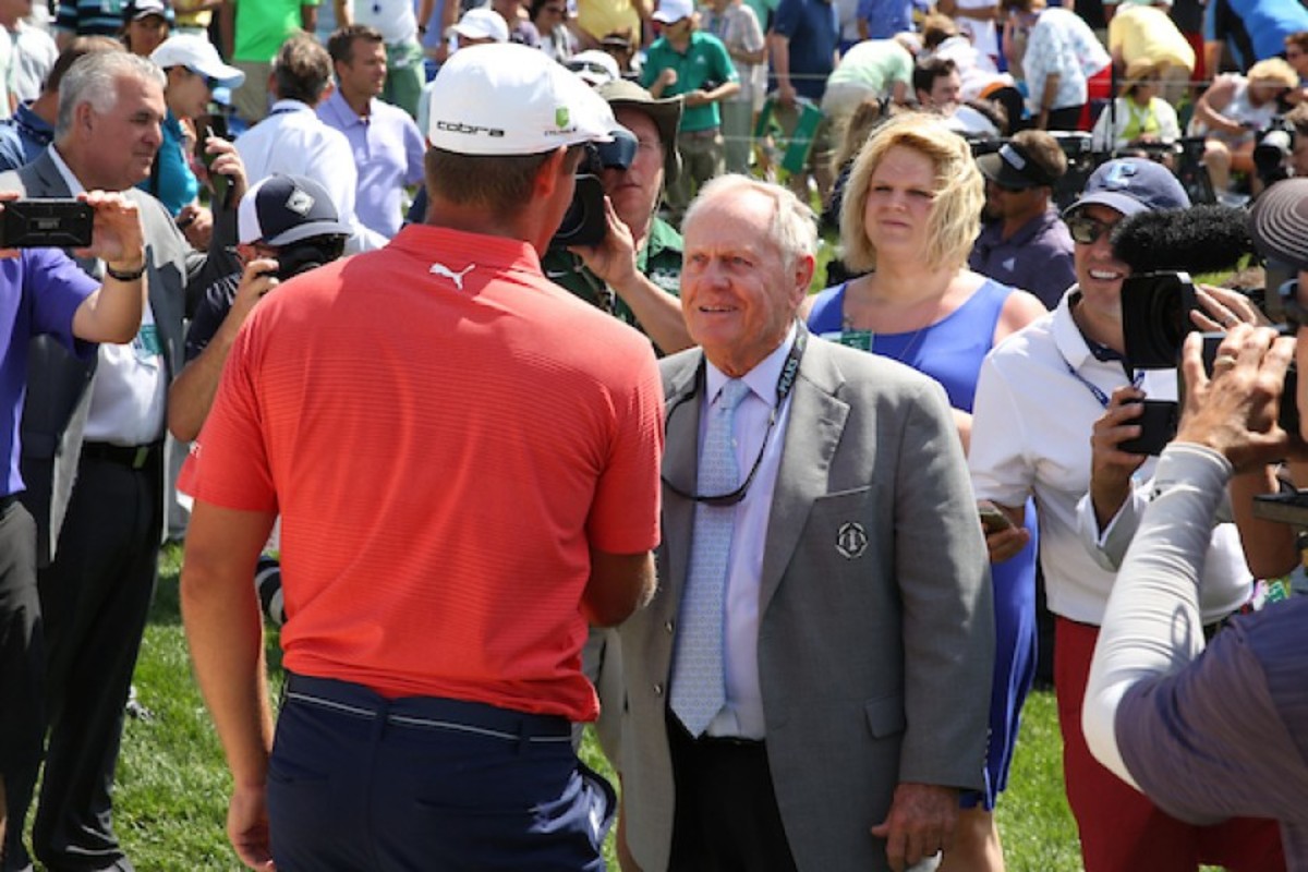 Memorial host Jack Nicklaus greets Bryson DeChambeau after his victory in 2018.