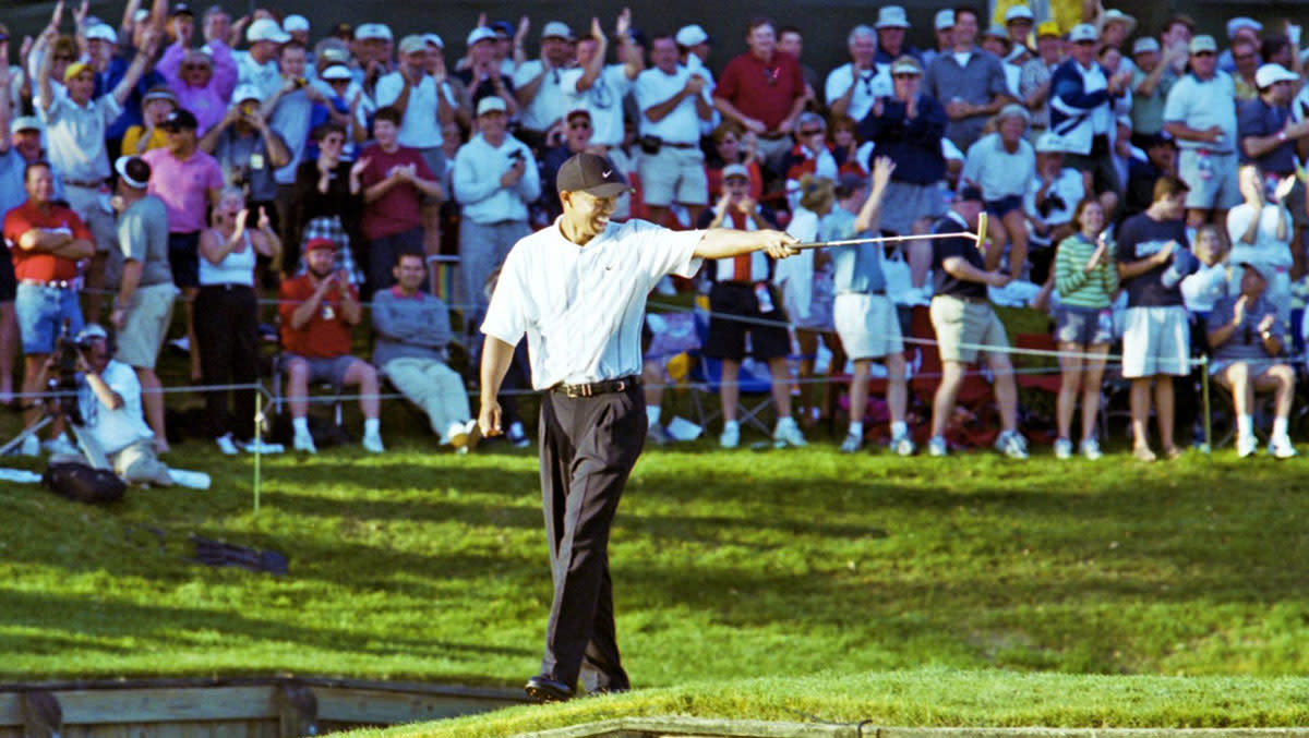 Tiger Woods points at Phil Mickelson during the 2021 Players Championship.