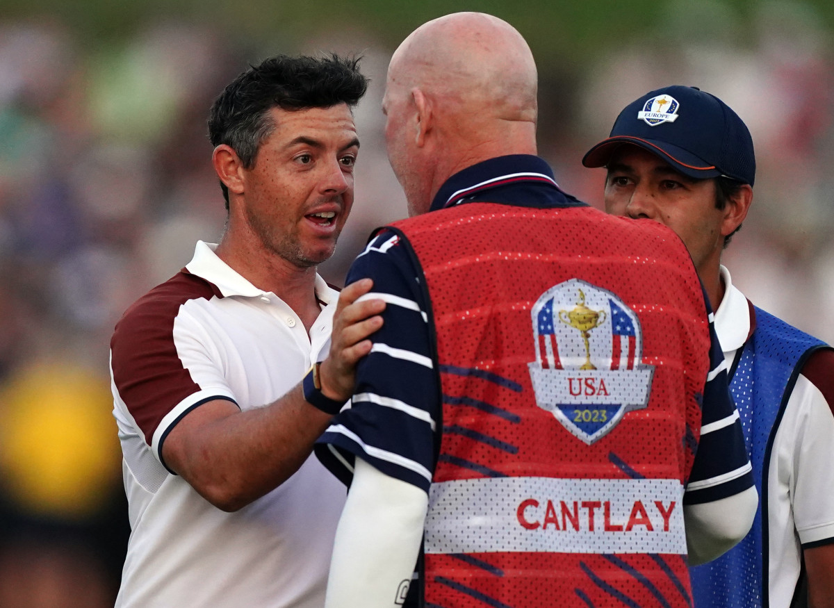 Team Europe's Rory McIlroy argues with Joe LaCava, caddie of USA's Patrick Cantlay on the 18th during the fourballs on day two of the 44th Ryder Cup at the Marco Simone Golf and Country Club, Rome, Italy.