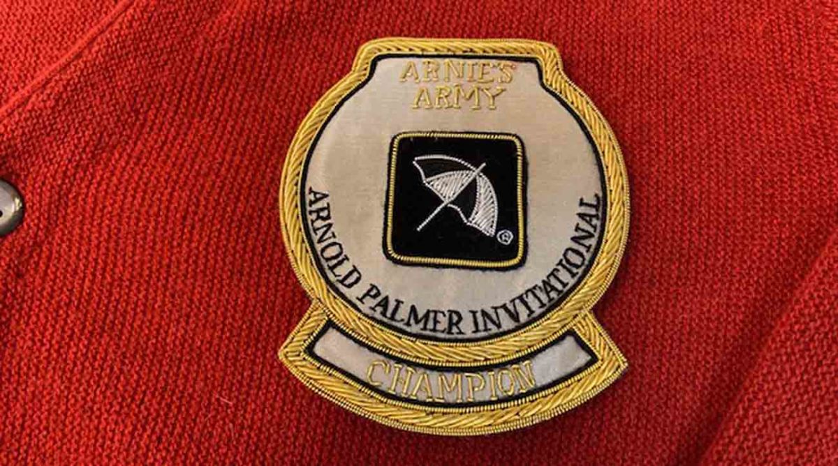 The patch on the red cardigan sweater awarded to the winner of the Arnold Palmer Invitational.
