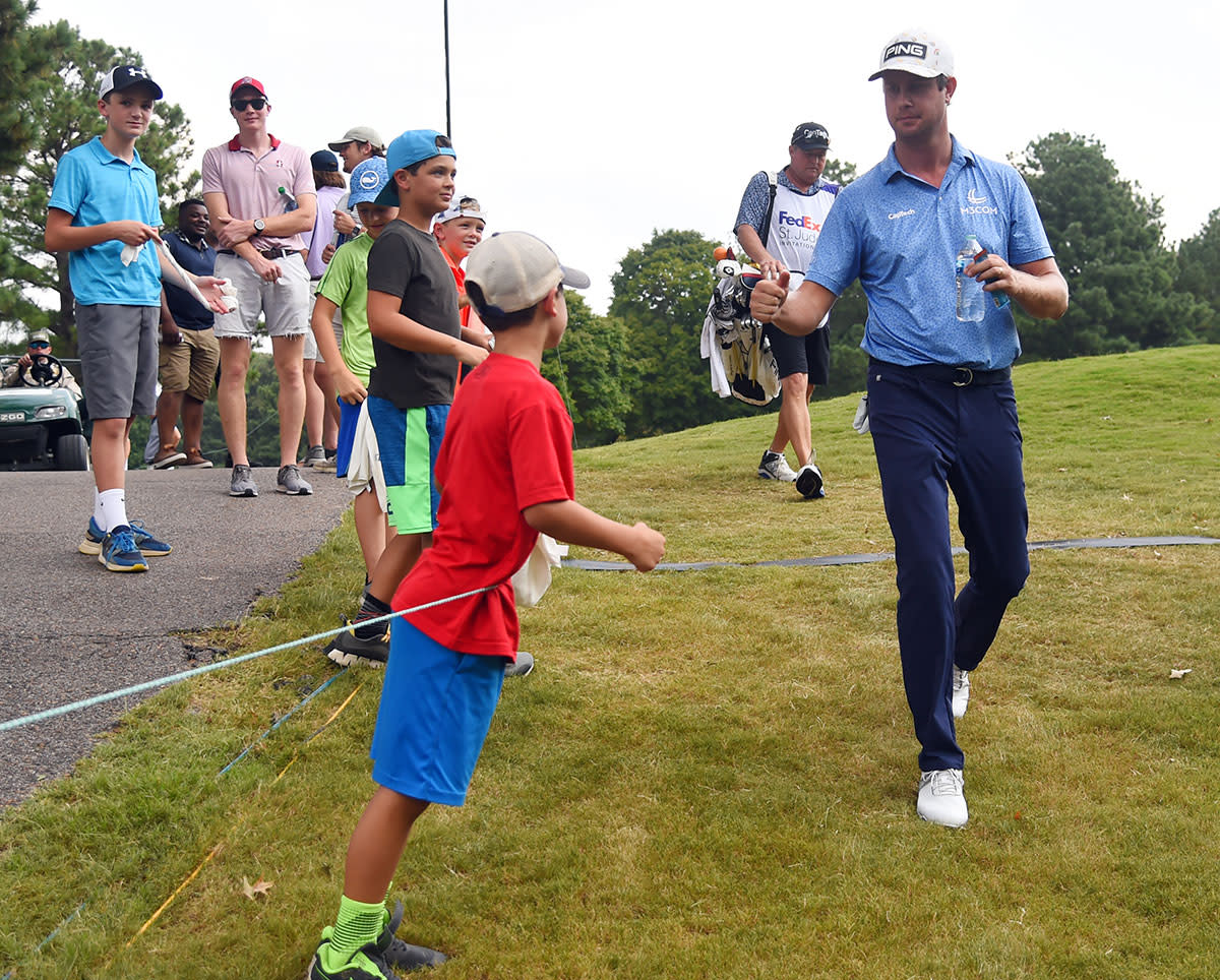 Harris English fist-bumps a fan at TPC Southwind in Memphis.USA Today