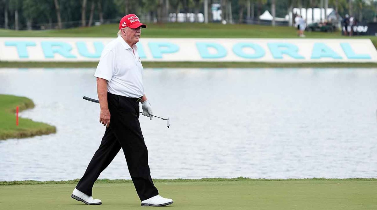 Former President Donald Trump walks to the 18th green during the pro-am before the LIV Golf Invitational Miami.