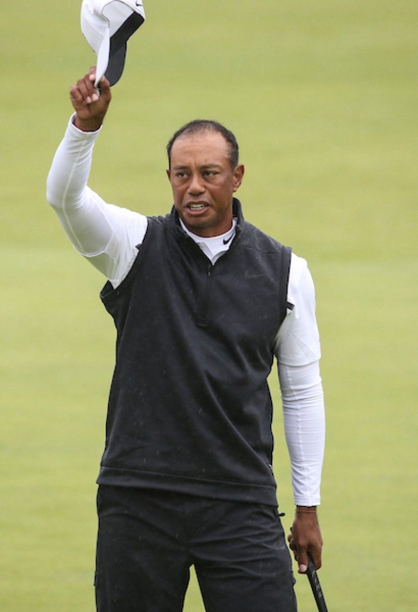 Tiger Woods acknowledges the crowd on the 18th green Friday during the British Open at Royal Portrush in Northern Ireland.