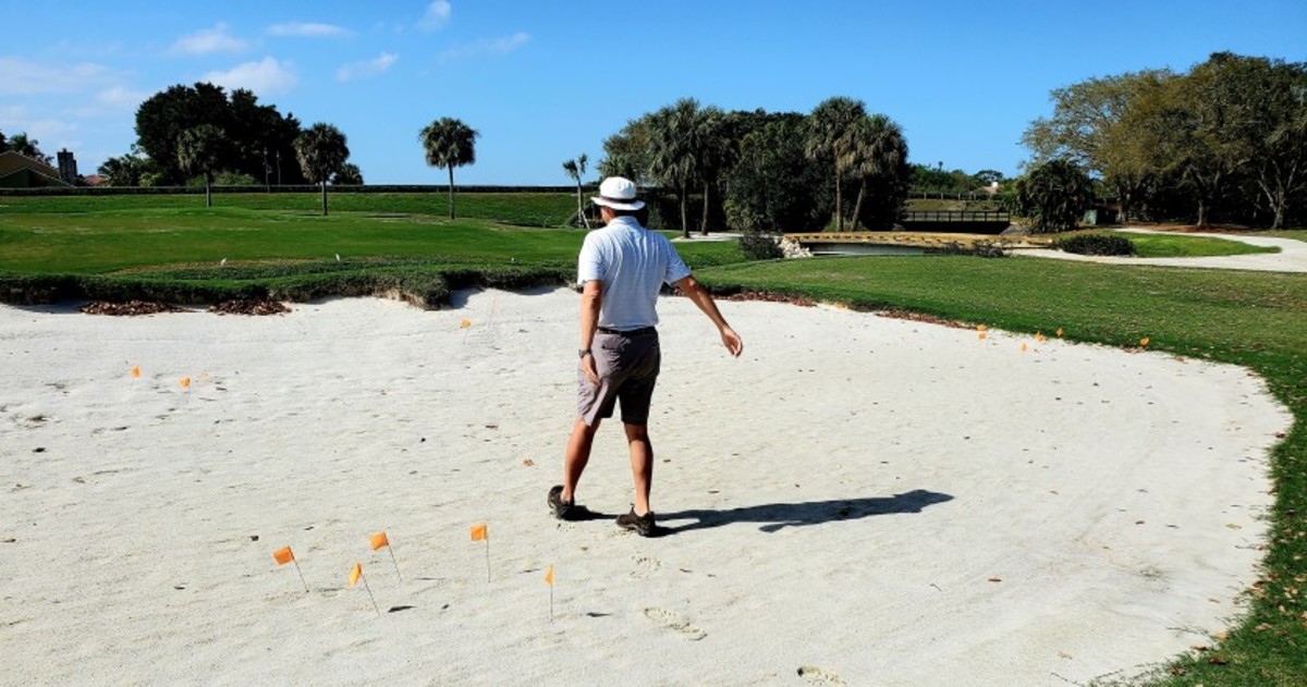 Course architect Andy Staples stands in a bunker that will also double as a teeing ground on the new par-3 course that Staples is designing at PGA National Resort and Spa.