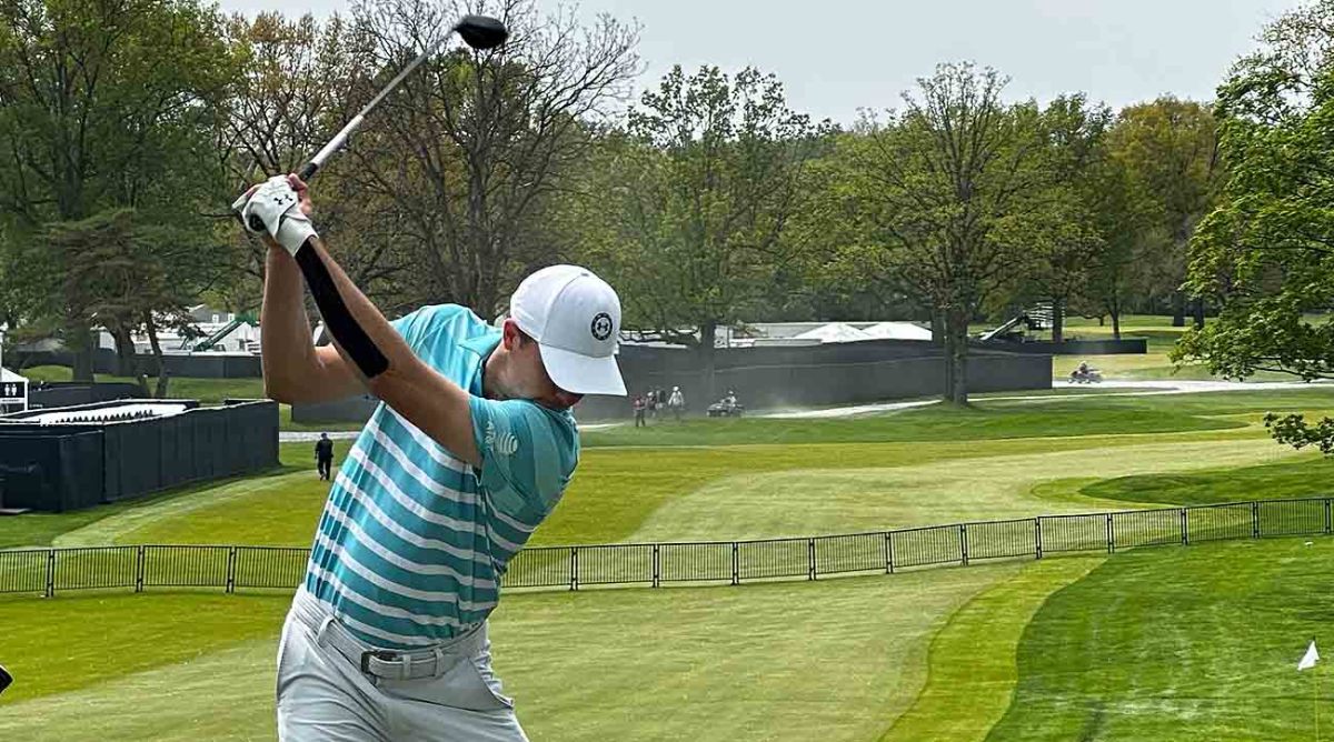 Jordan Spieth hits balls on Tuesday at the PGA Championship with tape on an injured left wrist.