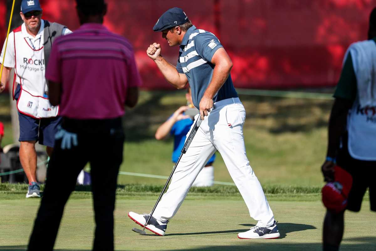 Bryson DeChambeau (center) celebrates his victory at the 2020 Rocket Mortgage Classic in Detroit.
