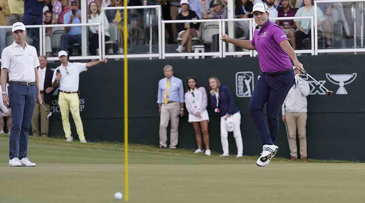 Luke List, right, leaps as he sinks a 43-foot putt for birdie on No. 18 for the win at the Sanderson Farms Championship golf tournament Sunday, Oct. 8, 2023, in Jackson, Miss.