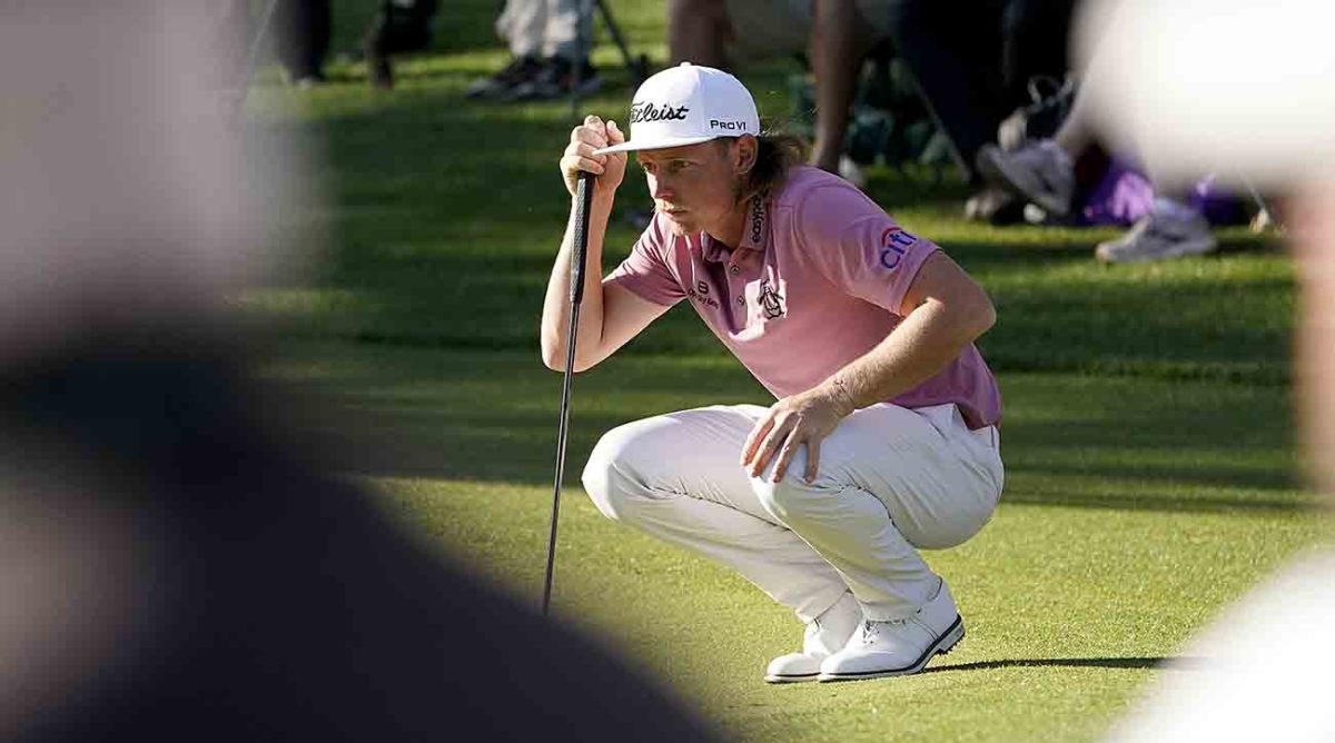 Cam Smith lines up a putt at the 2022 Masters Tournament.