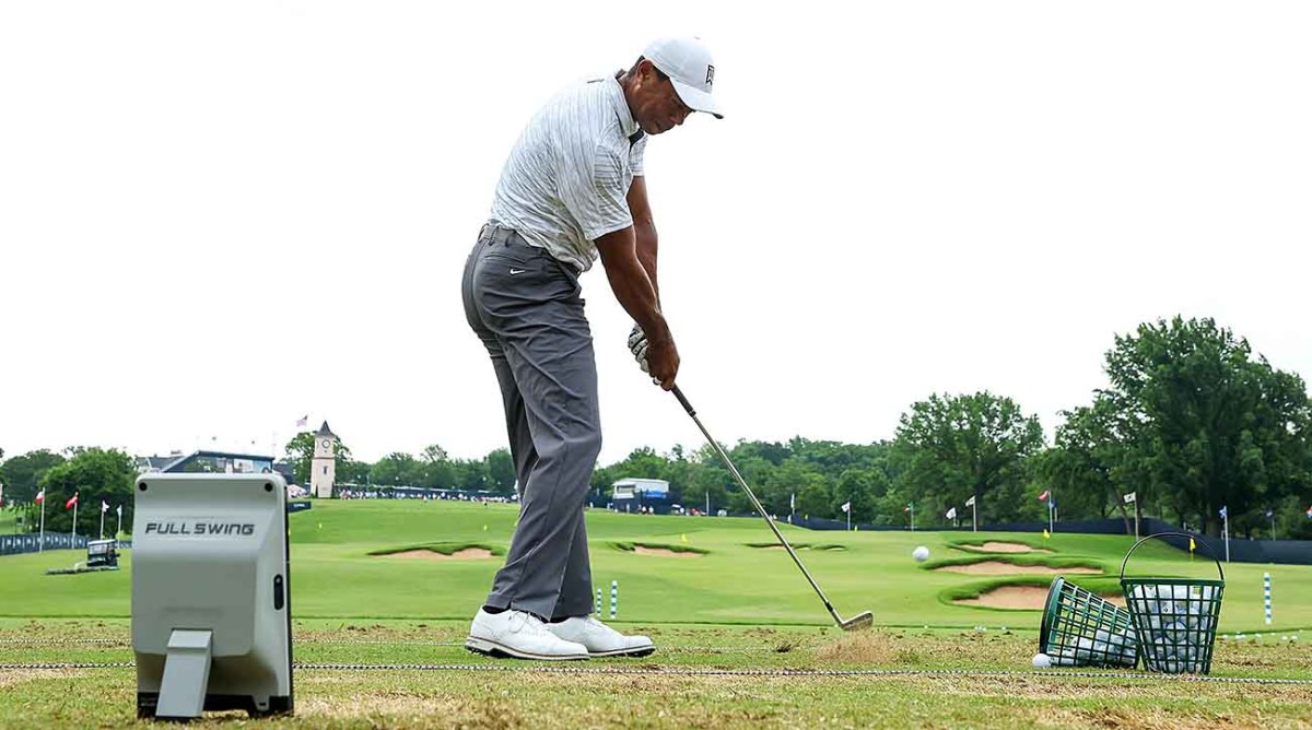 Tiger Woods works on the range with a Full Swing launch monitor at the 2022 PGA Championship at Southern Hills.