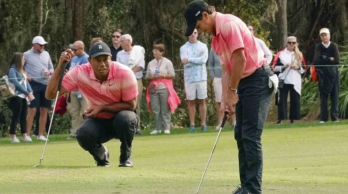 Tiger Woods watches Charlie Woods putt in the first round of the 2022 PNC Championship.