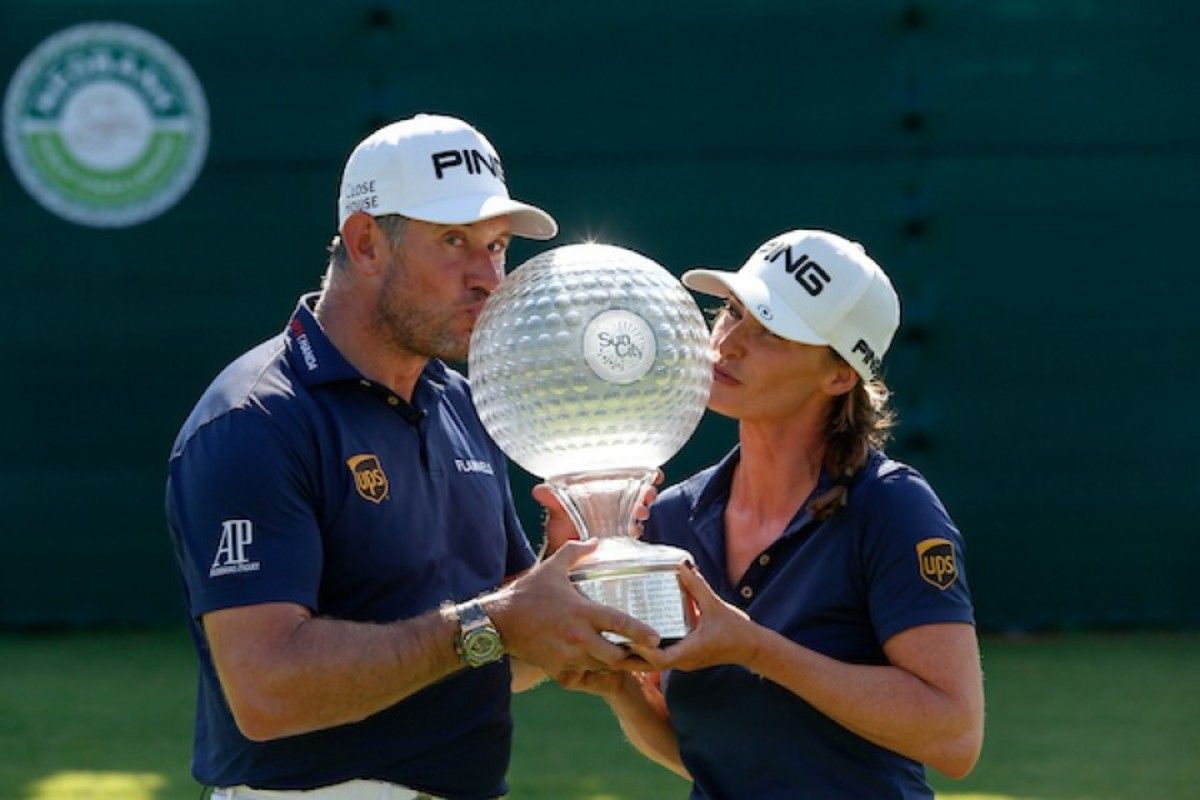 Lee Westwood and caddie/girlfriend Helen Storey embrace victory at the Nedbank Golf Challenge.