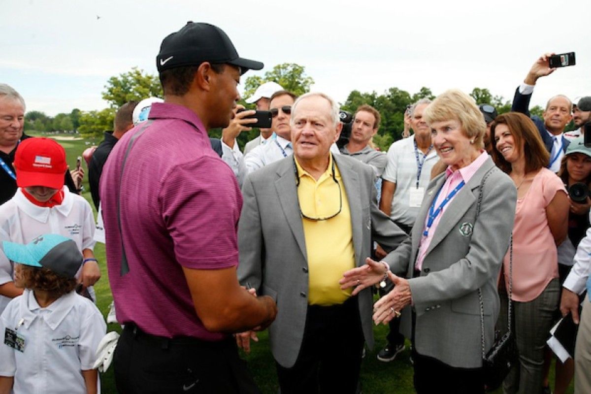 Jack Nicklaus (center) and his wife, Barbara, greet Tiger Woods, a 5-time champion of the Memorial Tournament, during a pro-am round before the 2018 event.