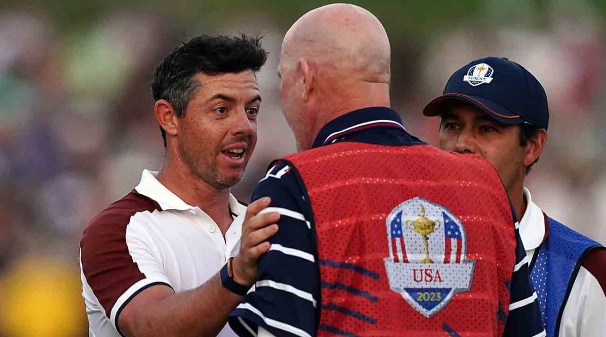 Team Europe's Rory McIlroy argues with Joe LaCava, caddie of USA's Patrick Cantlay on the 18th during the fourballs on Day 2 of the 2023 Ryder Cup at the Marco Simone Golf and Country Club, Rome, Italy.
