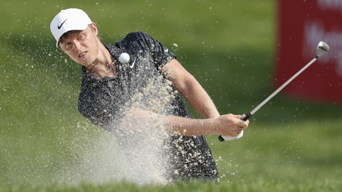 Cam Davis makes eagle from a greenside bunker on the 17th hole during the final round of the Rocket Mortgage Classic golf tournament.