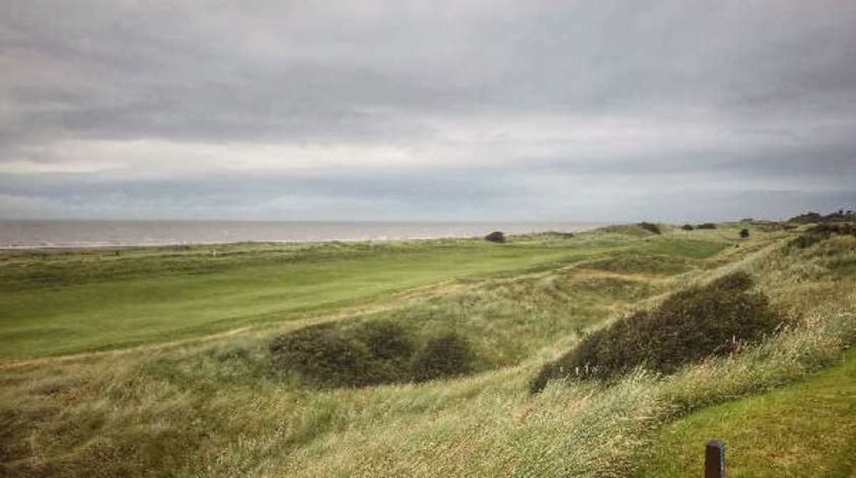 A view from the fourth tee back up the fifth fairway to the tee. The Irish Sea runs along the fifth hole's right side.